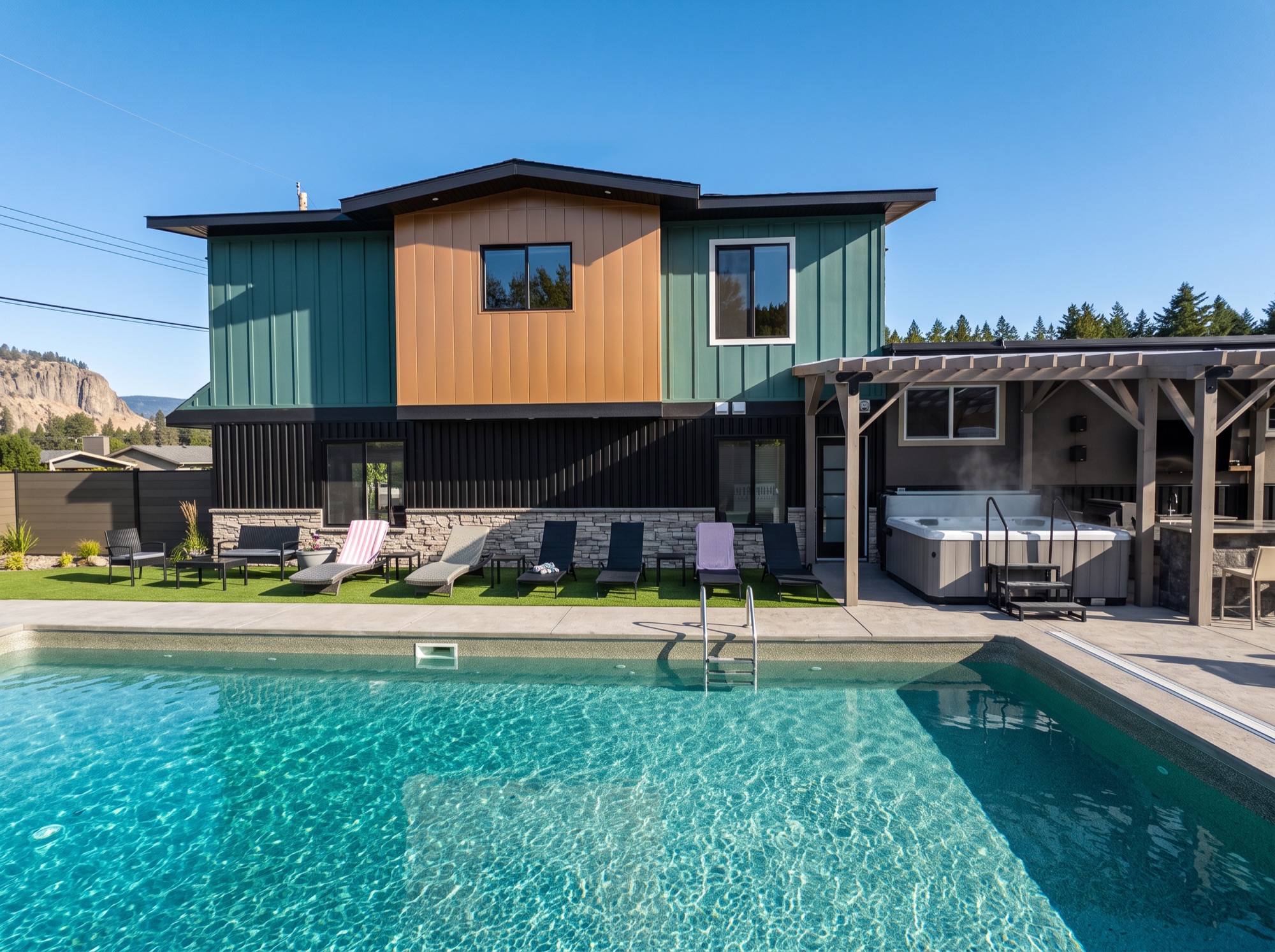 CastleRock pool and modern home in Kelowna at golden hour
