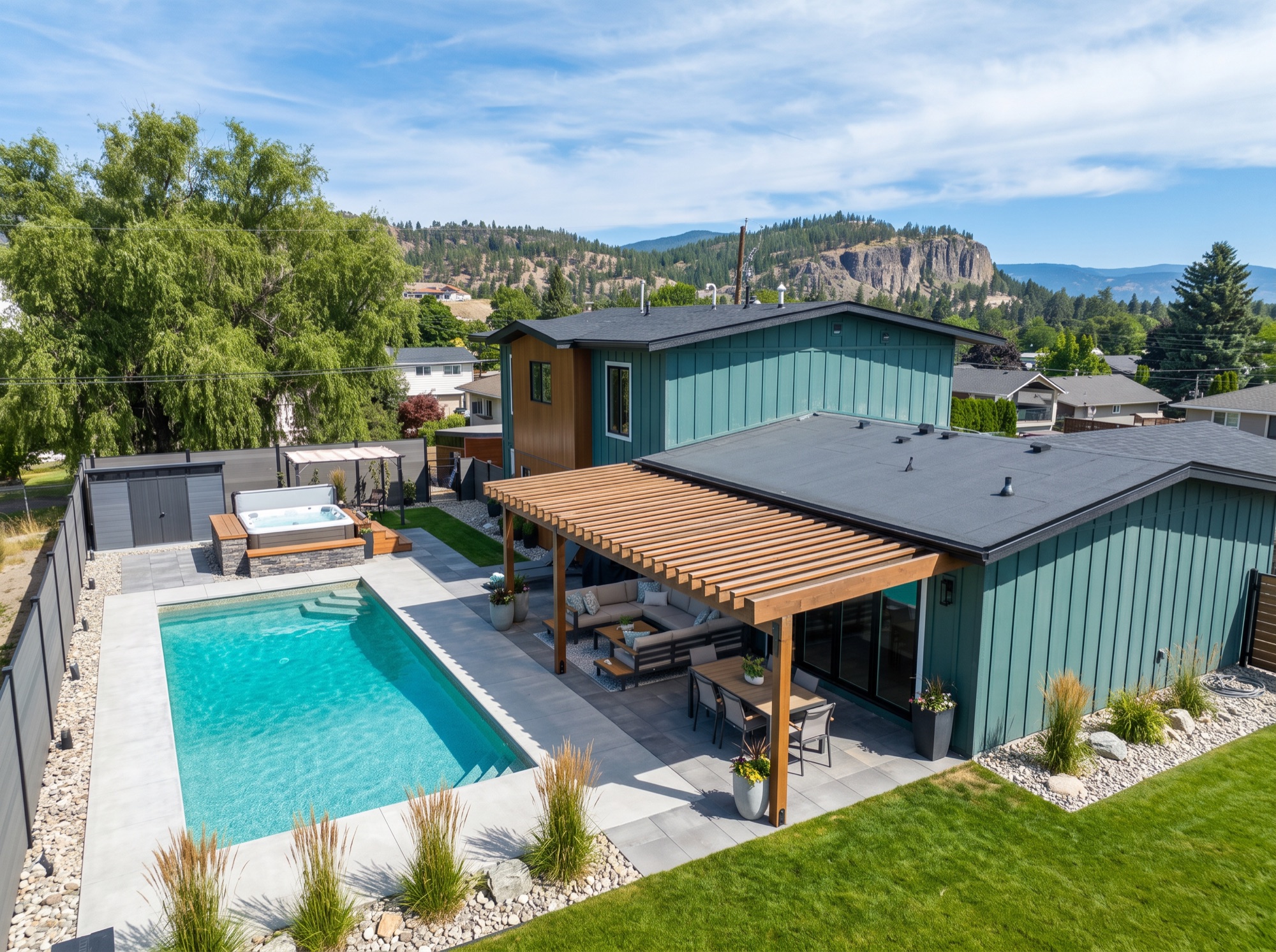 Aerial of pool, pergola and mountain backdrop