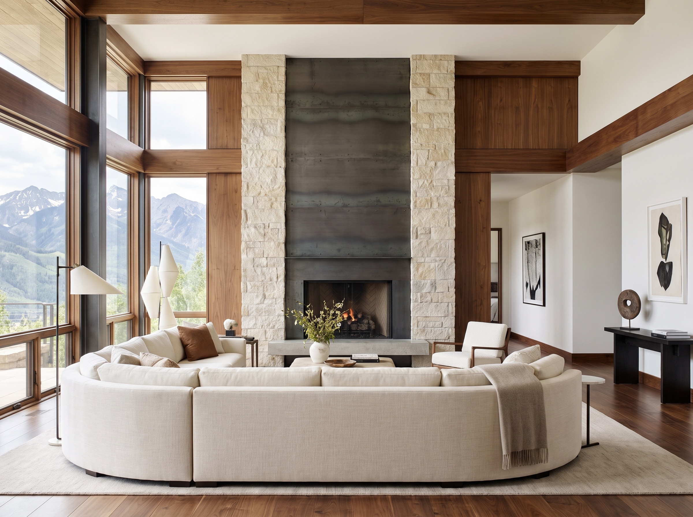 Bright modern living room with floor-to-ceiling windows and mountain views